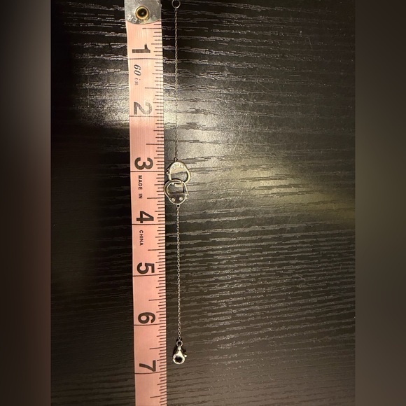 Elegant Silver Key and Handcuffs Bracelet - Picture 3 of 4